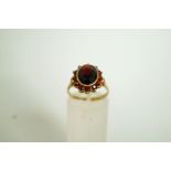 A garnet 9 carat gold cluster ring, the