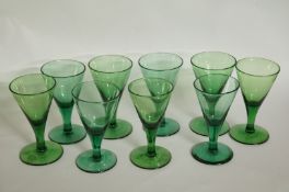 A collection of nine Victorian green gla