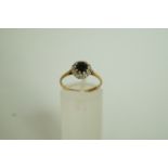 A sapphire and diamond 9 carat gold ring