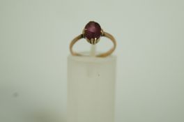 A single stone paste set ring, the shank