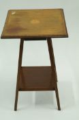 An Edwardian square top side table