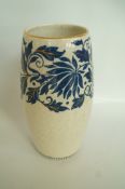 A vase decorated by Charlotte Rhead.