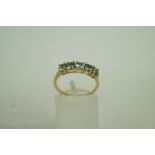 A five stone 9ct gold dress ring, finger