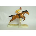 A Beswick girl on a jumping horse figuri