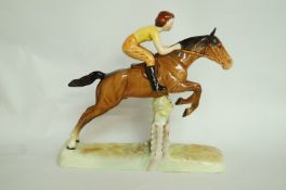 A Beswick girl on a jumping horse figuri