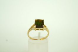 A single stone spectrolite 9ct gold ring