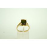 A single stone spectrolite 9ct gold ring