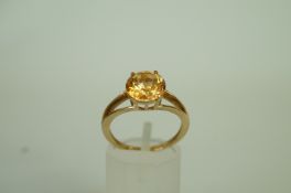 A 9ct gold dress ring, set with a round