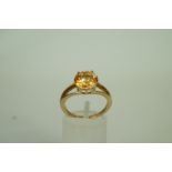 A 9ct gold dress ring, set with a round