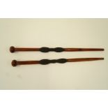 Two tribal mahogany sticks