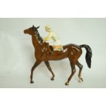 A Beswick racehorse and jockey figure, s