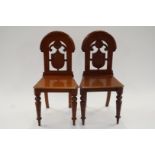 A pair of 19th century hall chairs