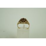 A 9ct gold garnet cluster ring, finger s