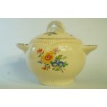 A Clarice Cliff jar and cover