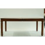 A large modern rosewood dining table and