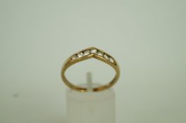 A seven stone cubic zirconia 9ct gold dr