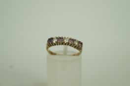 A seven stone 9ct gold half hoop ring, a