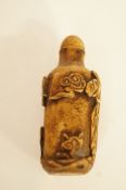An oriental carved scent bottle