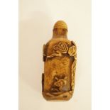 An oriental carved scent bottle