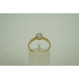 A diamond single stone 9ct gold ring, th