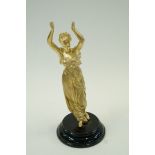 A gilt painted spelter figure of a class