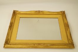 A large decorative gilt framed mirror