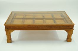 A modern glass and teak coffee table