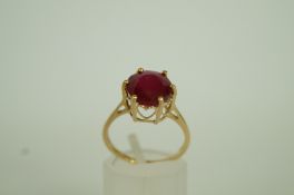 A single stone ruby 9ct gold ring, finge
