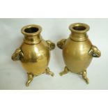 A pair of 20th century oriental brass va