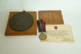 A WWI death plaque, WWII soldier's pay b