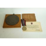 A WWI death plaque, WWII soldier's pay b