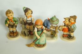 A collection of Hummel/Goebel figures