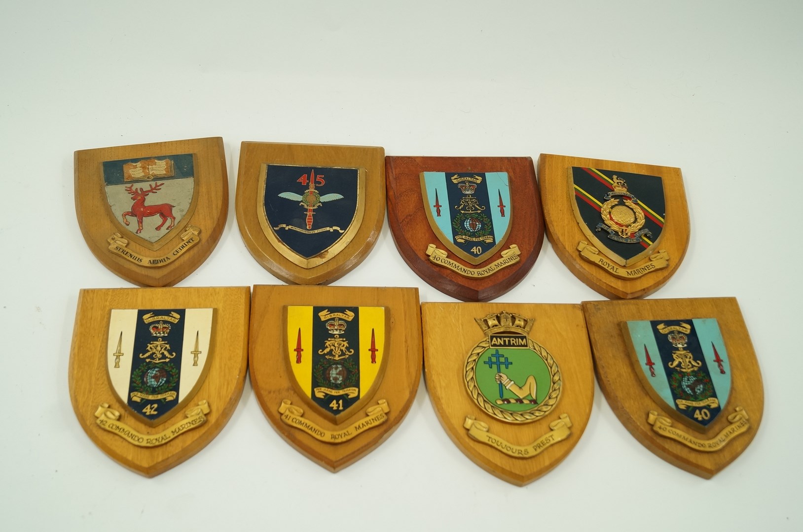 Eight military regimental shield plaques