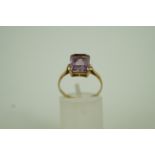 A single stone amethyst 9ct gold dress r