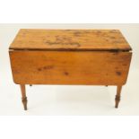 An elm drop leaf table