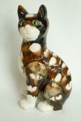 A large early pottery cat signed E. Gall