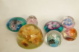 A collection of seven paperweights inclu