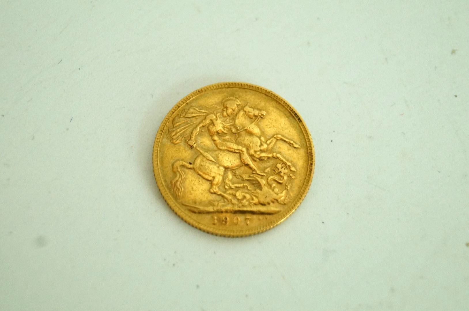 A gold half sovereign 1907