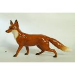 A Beswick long tailed fox