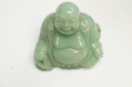 An oriental hardstone figure of Buddha