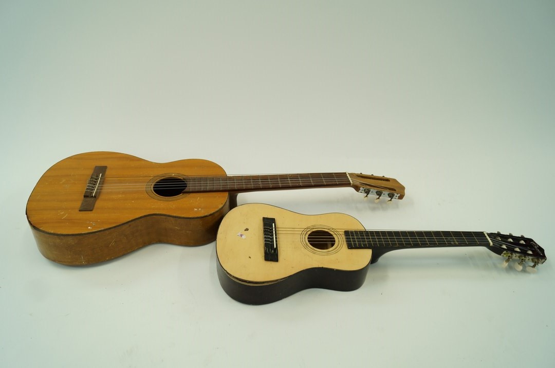 A Spanish guitar and one other