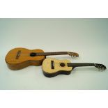 A Spanish guitar and one other