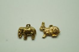 A 9ct gold elephant charm; with a 9ct go