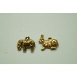A 9ct gold elephant charm; with a 9ct go