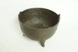 An antique iron cauldron