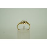 A two stone diamond cross over ring, sta