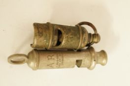 A WWII ARP whistle and one other whistle