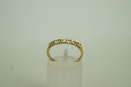 A stone set half hoop 9ct gold ring, fin
