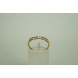 A stone set half hoop 9ct gold ring, fin