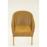 A Lloyd Loom style chair by 'Sirrom' of tub shape and painted gold